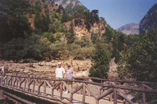 Crossing a bridge to the old Samaria village inside the gorge